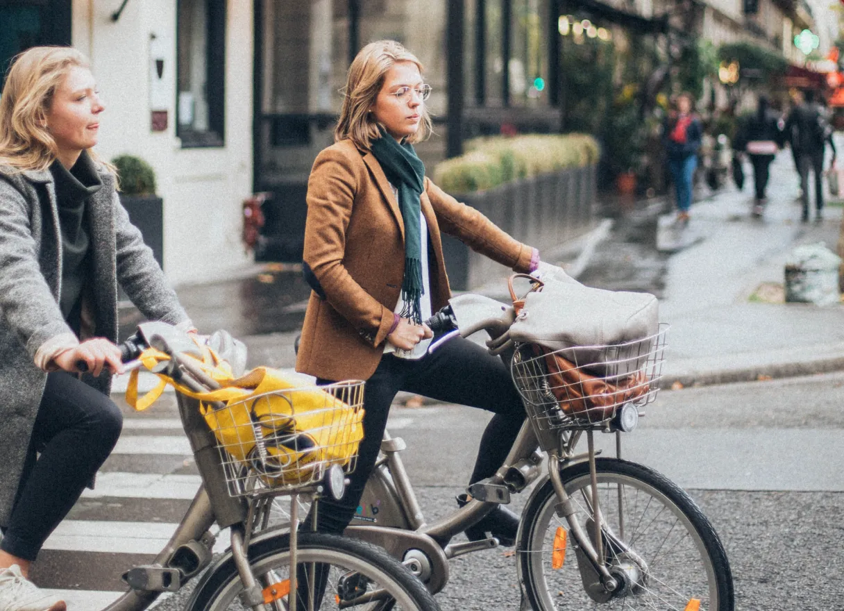 Two women riding bikes