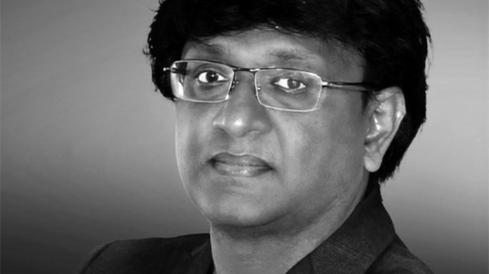 A black & White headshot of Slate CTO Senthil Kumar