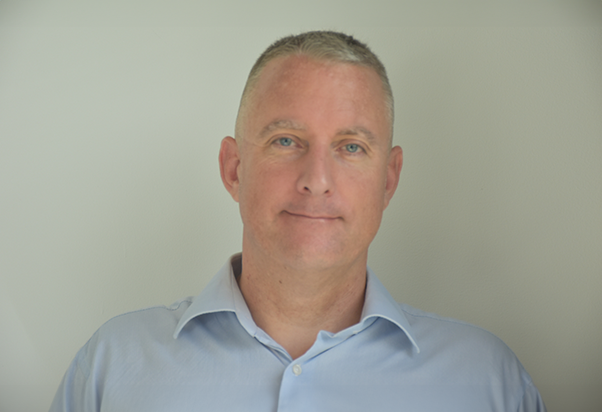 Nick Hudson, one of the founders of Agility Arabia. He is smiling, and is dressed in a blue shirt