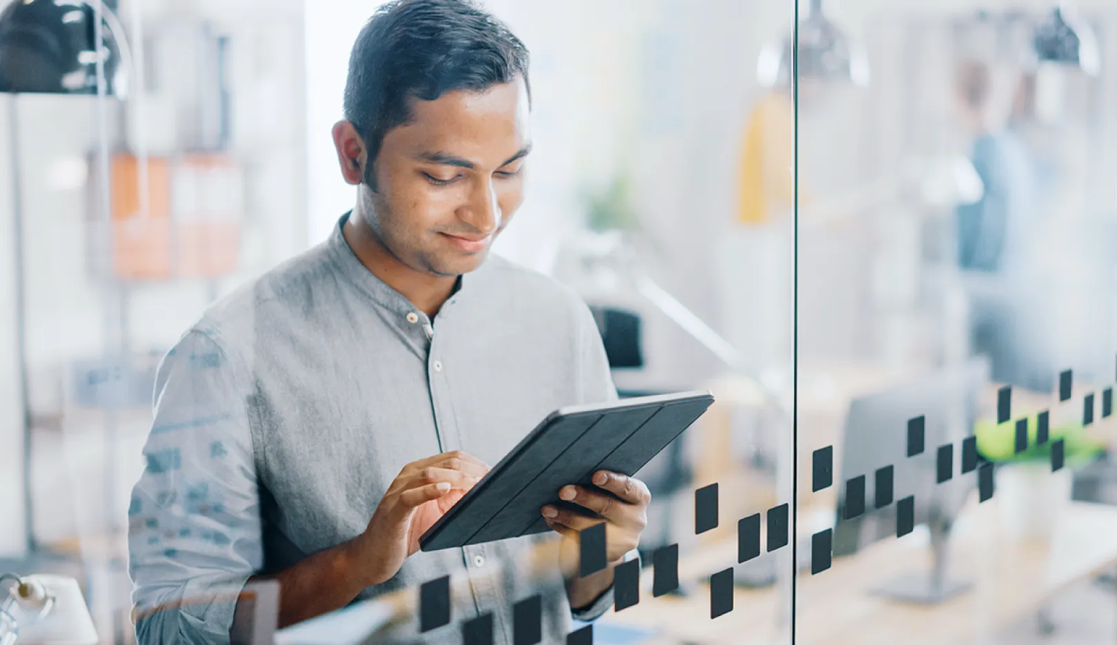 a man holding a tablet