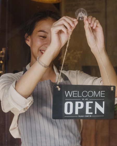 Asian woman opening her business