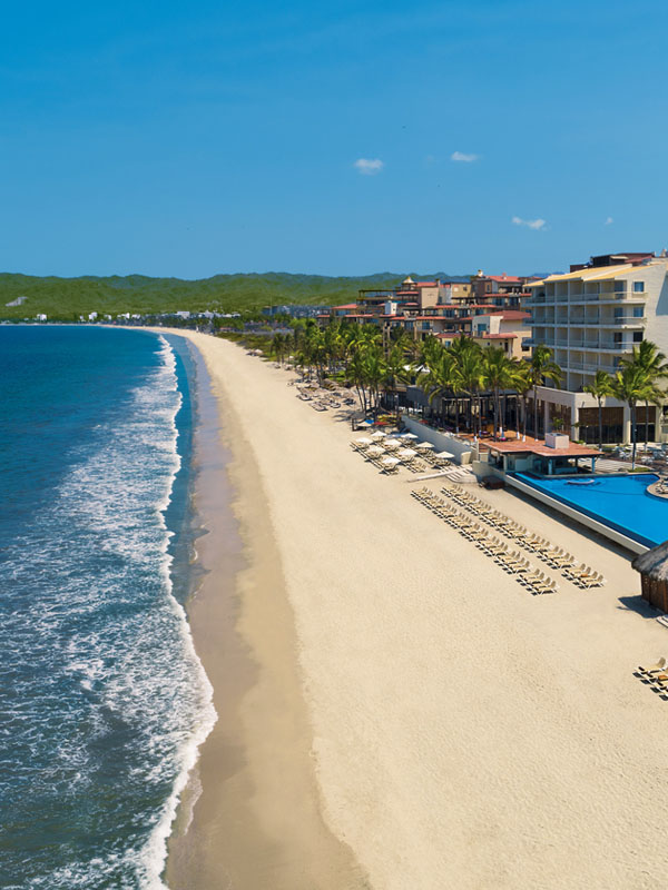 Nuevo Vallarta beach Mexico with golden sand and calm turquoise water