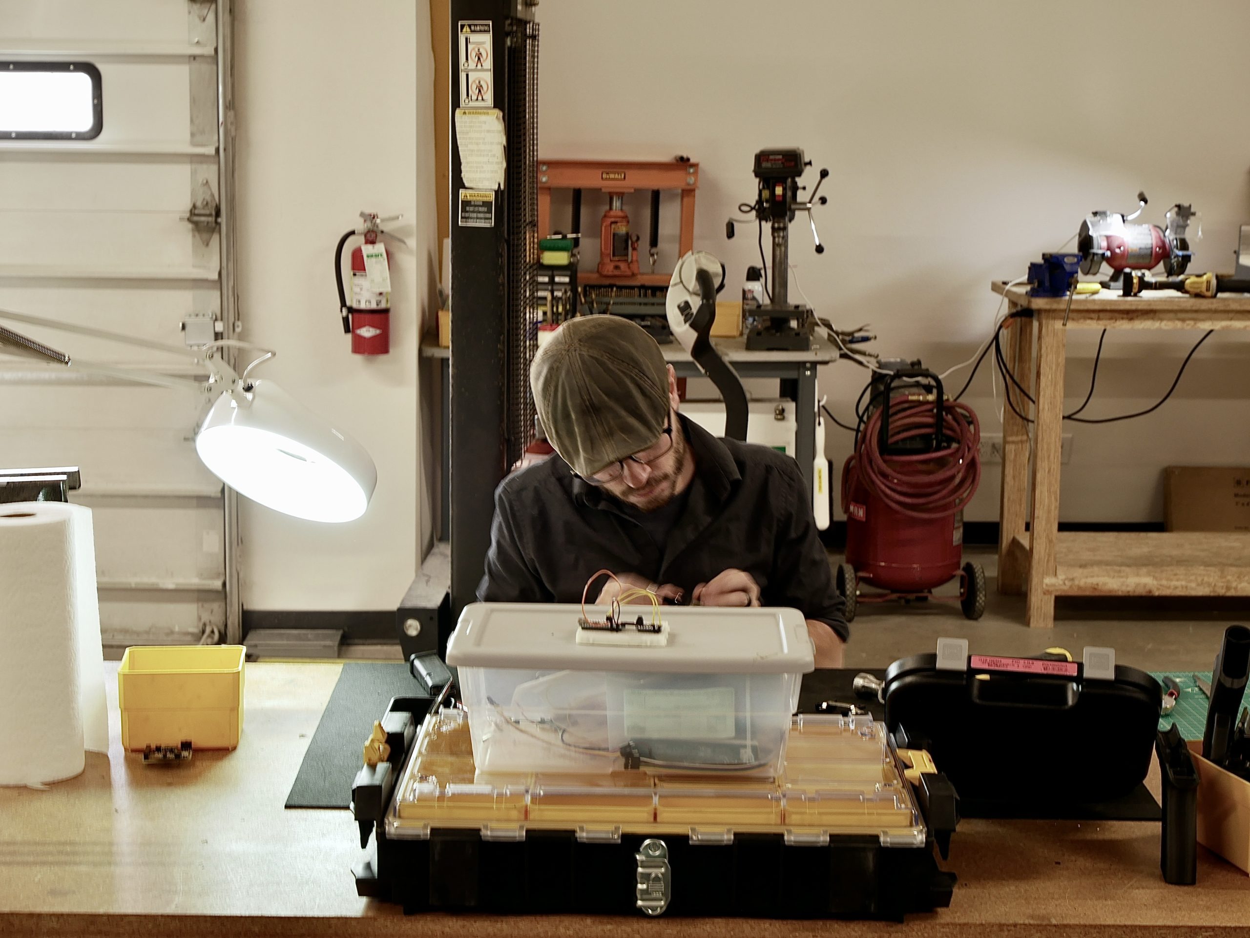 Engineer working on a prototype in a shop