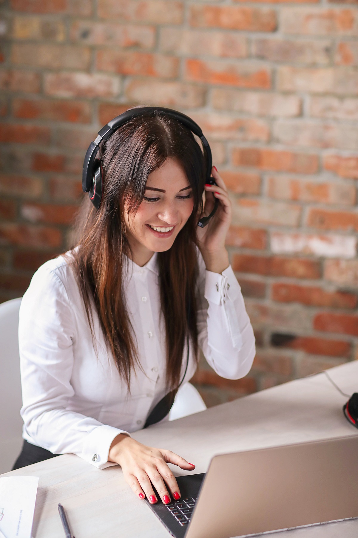 photo of a person who is receiving a call at perch service apartments and answering client queries