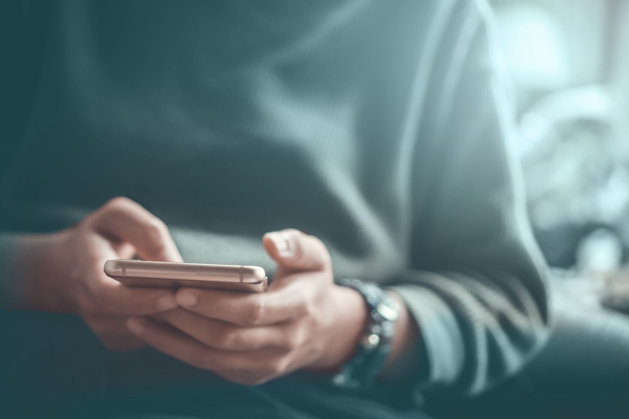 Person holding mobile phone