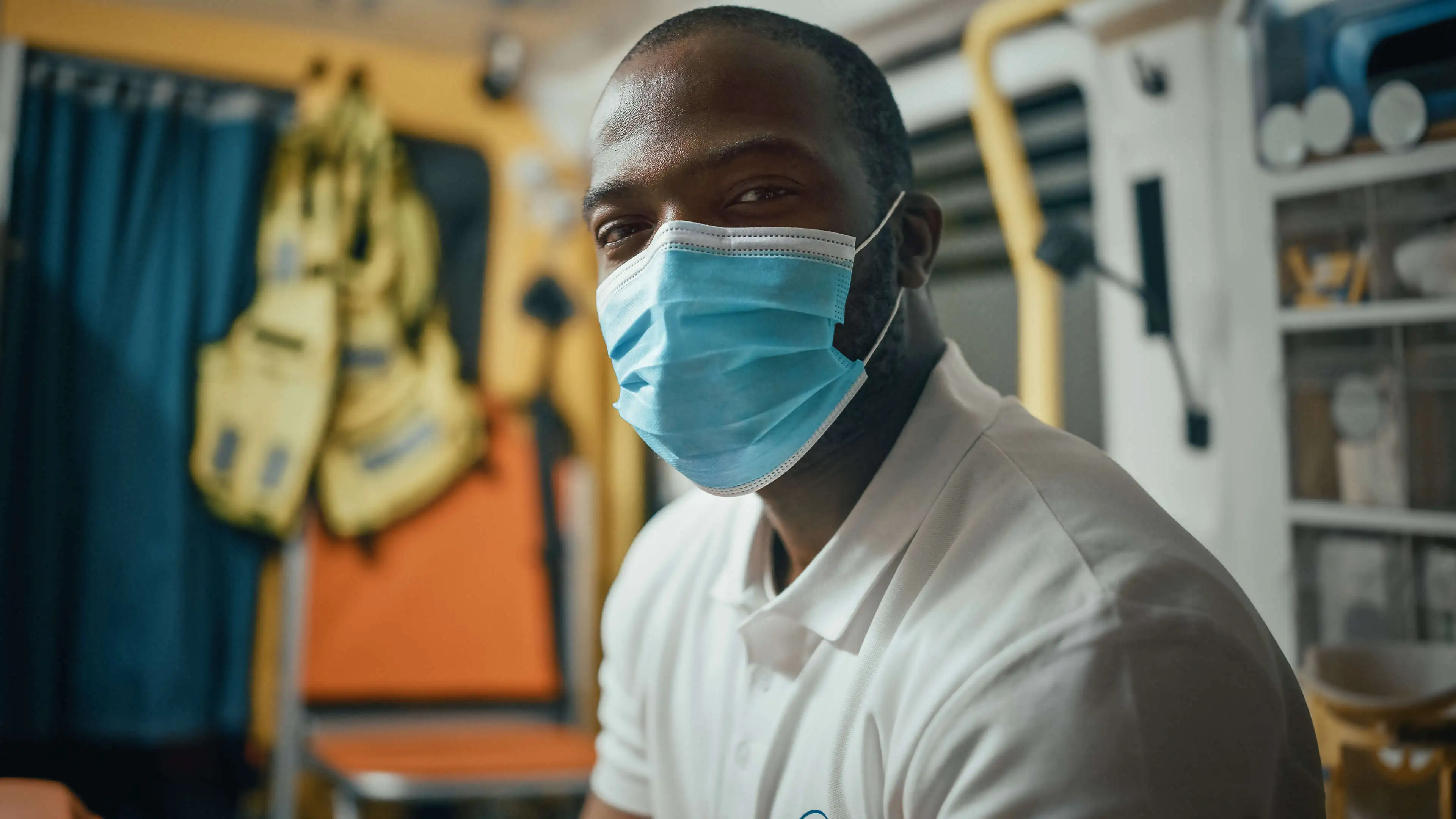 Portrait of a Black man wearing a surgical face mask