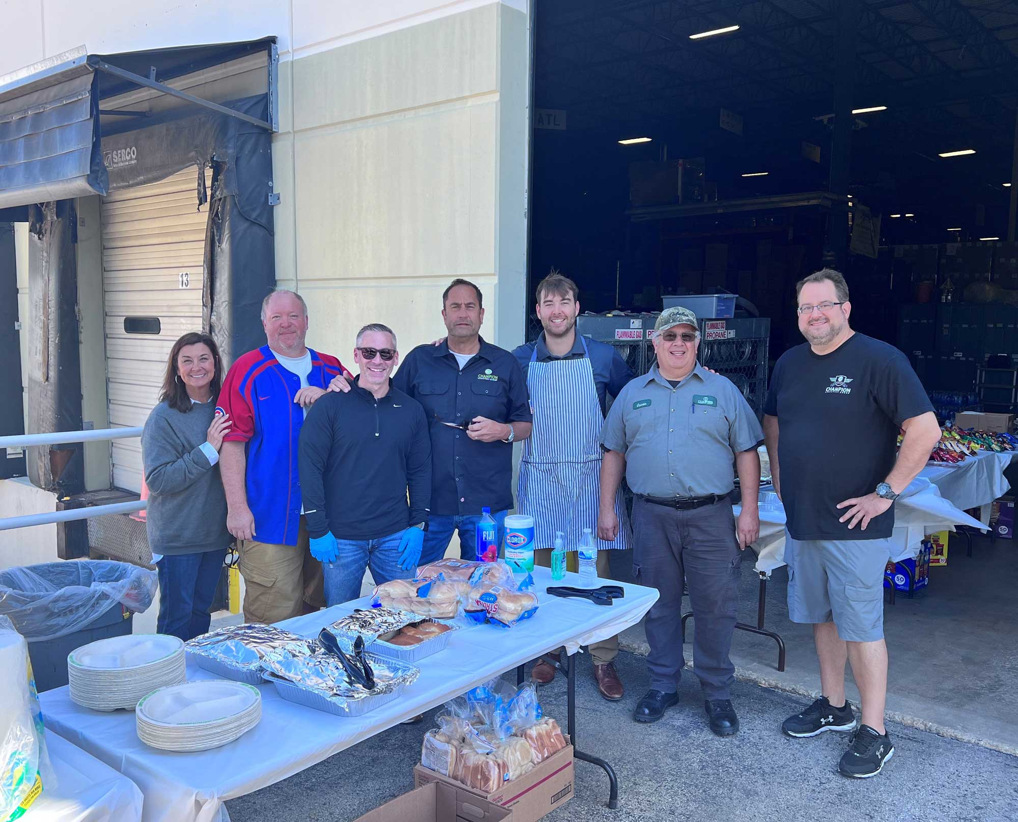 Champion employees gathered outside during a driver appreciation barbeque. 