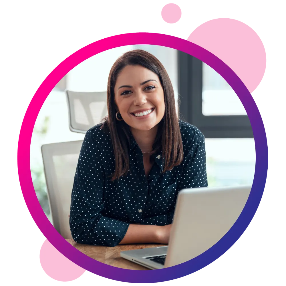 Person sitting with their laptop smiling