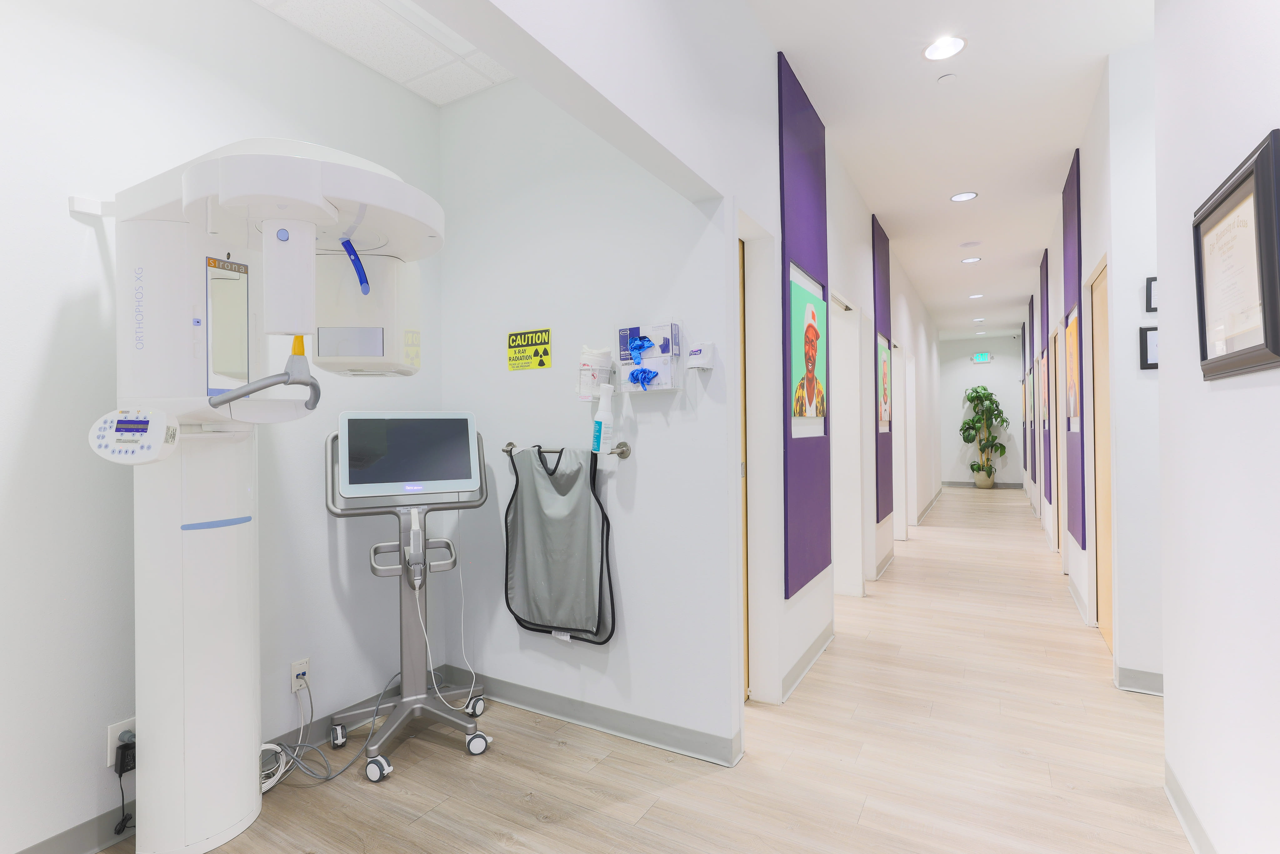 a dental clinic with a monitor and medical equipment