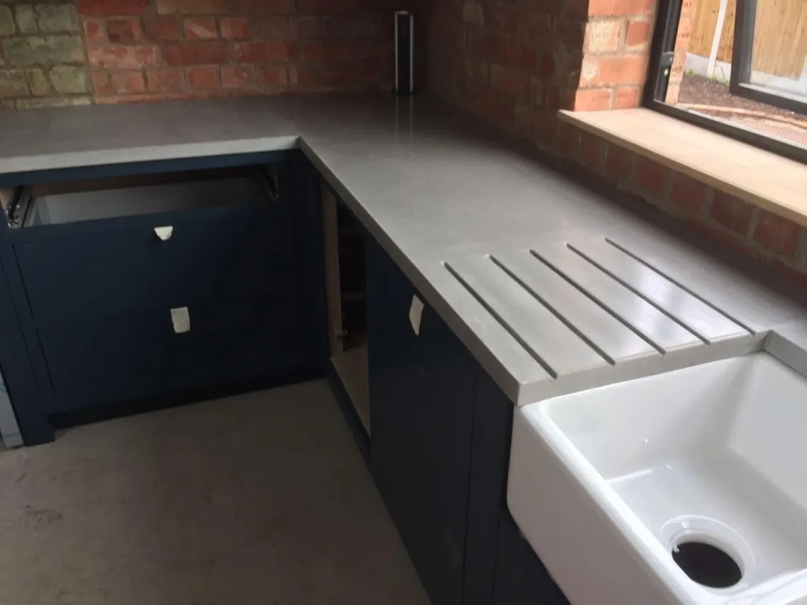 Kitchen polished concrete worktop & single sloped sink fitted in London