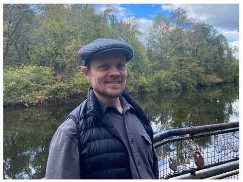 This is a picture of me standing on a small bridge next to a river in New Jersey.