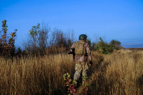 Frontline Fields; Ukrainian soldier on an open field in between trench lines. October 4, 2023. Kupyansk Ukraine
