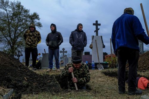Gravediggers; Gravediggers at work in Hroza. On 5 October 2023, a missile struck a café in the small village of Hroza in eastern Ukraine, killing 59 people attending a funeral reception. October 9, 2023. Hroza Ukraine