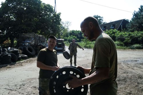 Repairing Tires; Frontline work requires car repair stores. In Slovyansk, a small team is running a pop-up garage, constantly on the move between hot zones to help fix all kinds of problems on military pickups quickly and free of charge for Ukraine's armed forces. September 3, 2023. Slovyansk Ukraine