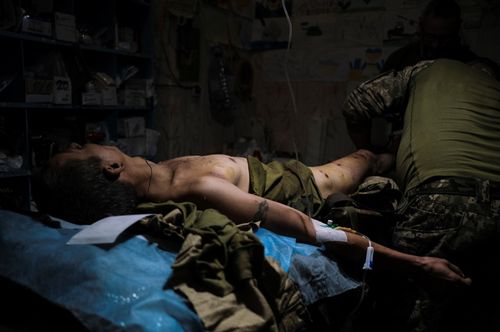 Stabilisation point (1); In the stabilisation hospital in Chasiv Yar, every minute is vital. Dozens of war wounded are being cared for, day and night and under falling bombs. September 29, 2023. Chasiv Yar Ukraine