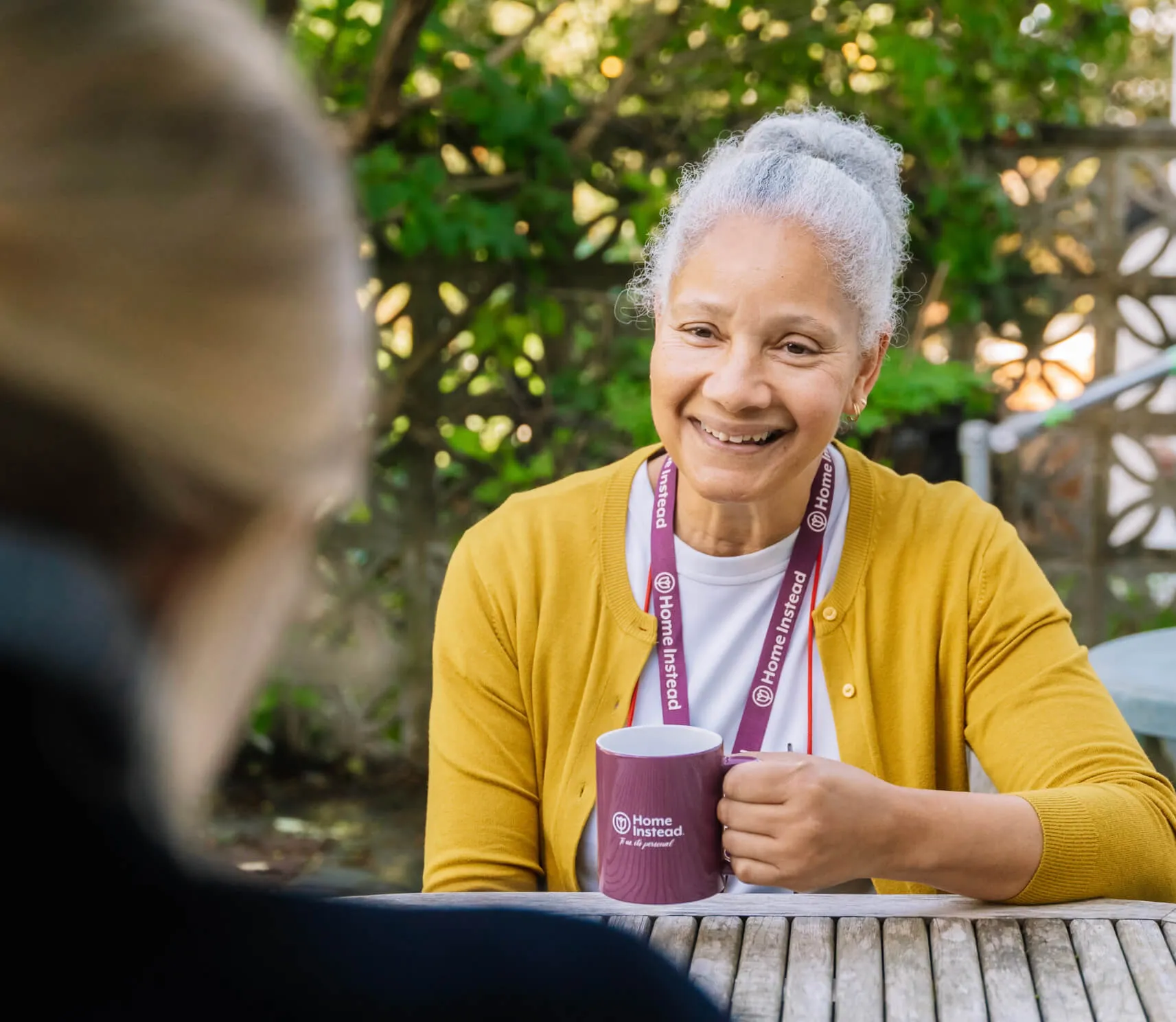 Home Instead employee visiting a patient