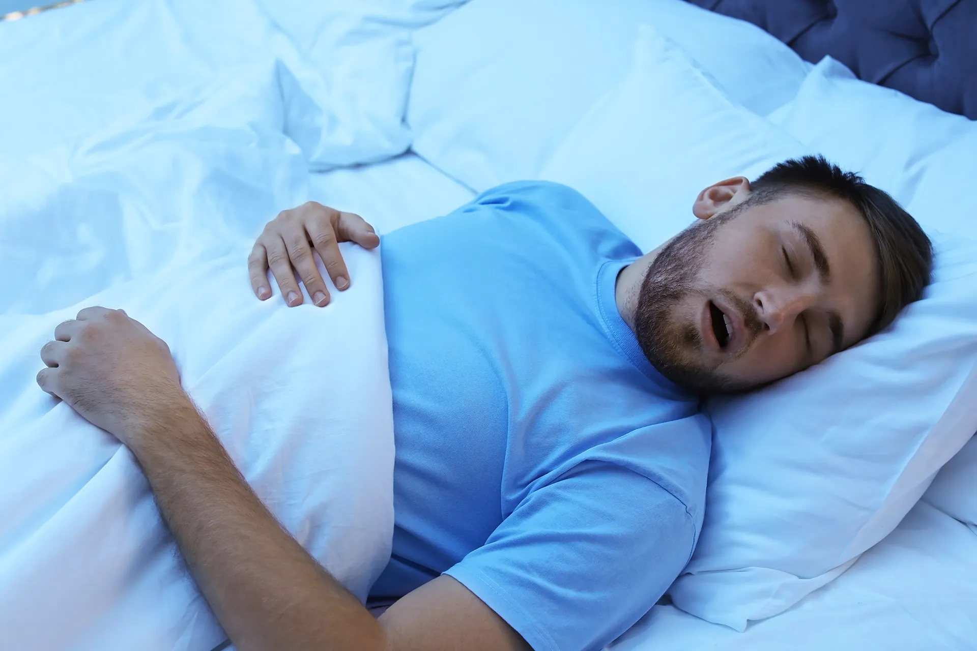 man sleeping with mouth open