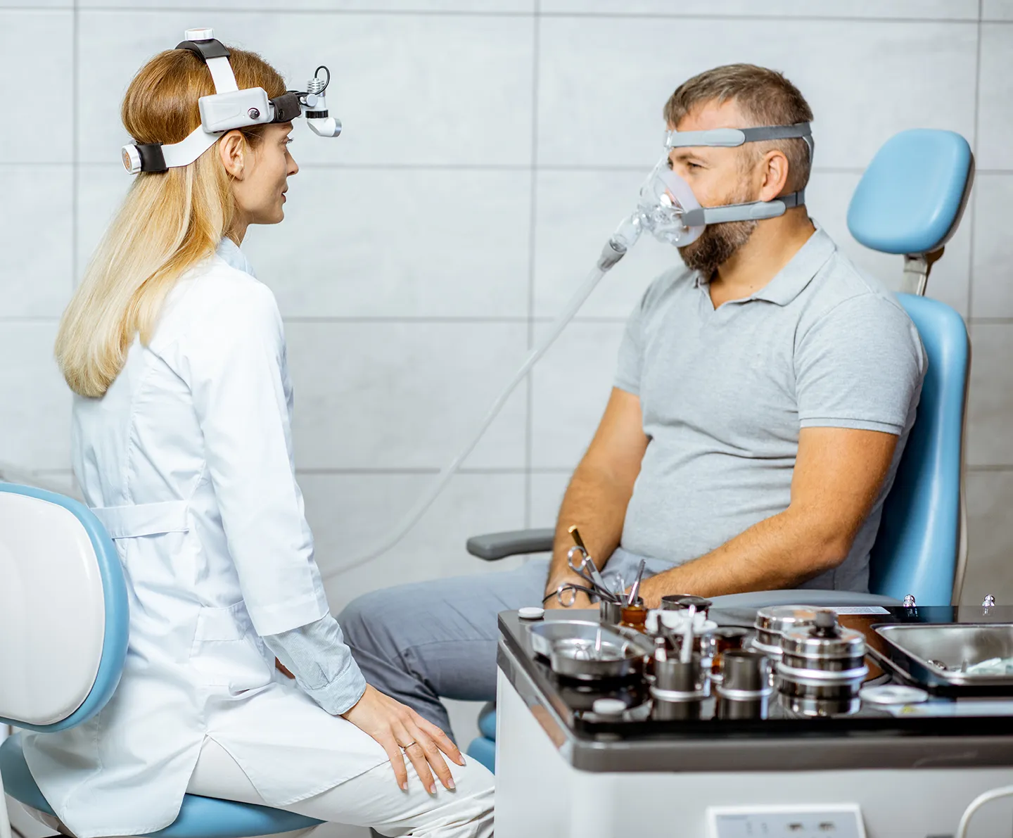 a dentist and patient with a sleep apnea device