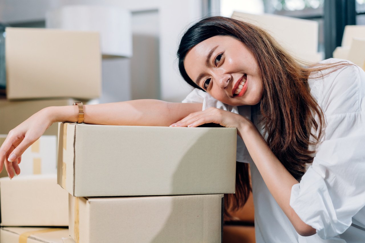 mobile ecommerce seller smiling