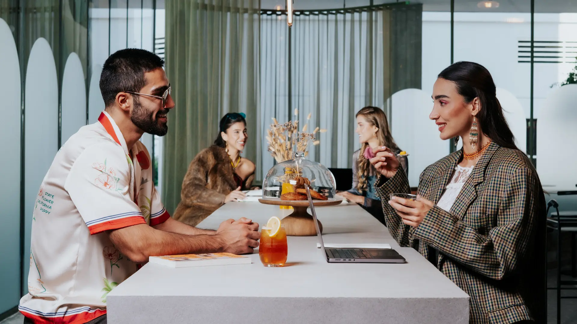 Coworking space with pastries on the table The Muse Dubai