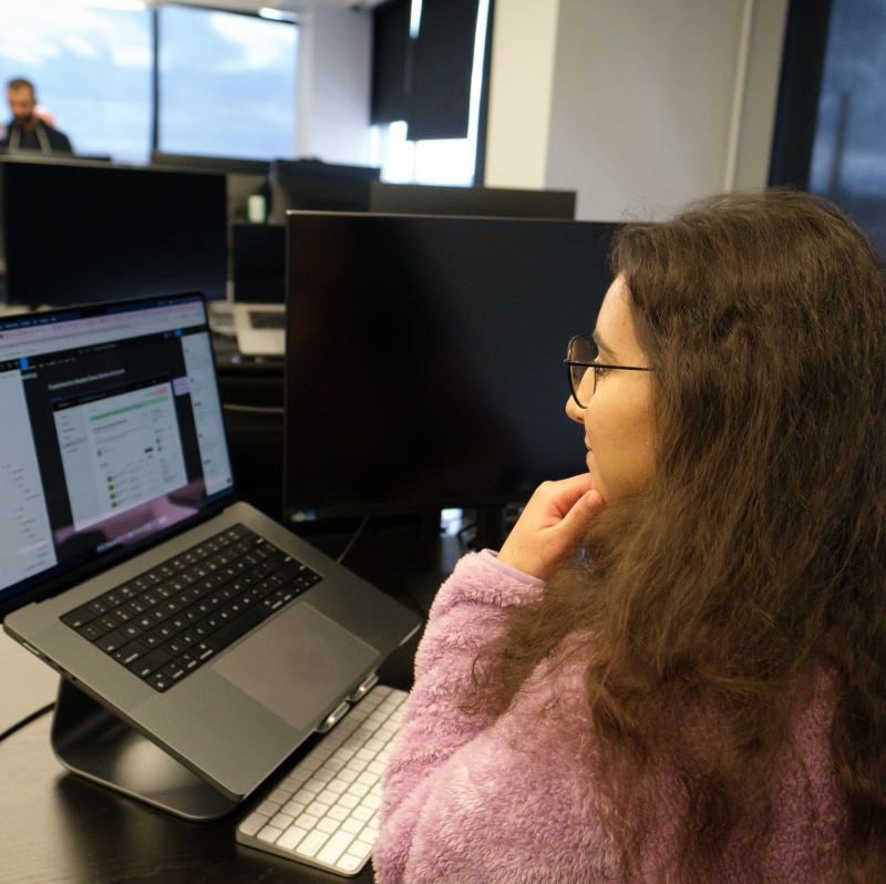 MasterClass employee working on her laptop